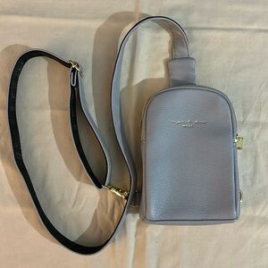 baby blue inicat crossbody bag with gold zippers and clip